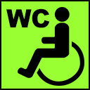 Grünes WC-Symbol als Markierung für barrierefreies WC